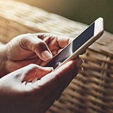 Woman contacting her doctor using telemedince on her smartphone