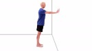 An exercise illustration shows a bald man in a blue shirt and black shorts standing and facing a wall with his arms outstretched and his hands flat against the wall.