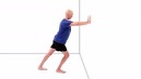 An exercise illustration depicts a bald man wearing a blue shirt and black shorts. The man is standing parallel to a wall, with his arms outstretched and hands pushed against the wall. He is bending his front leg, leaning forward, and extending his back leg behind his body.